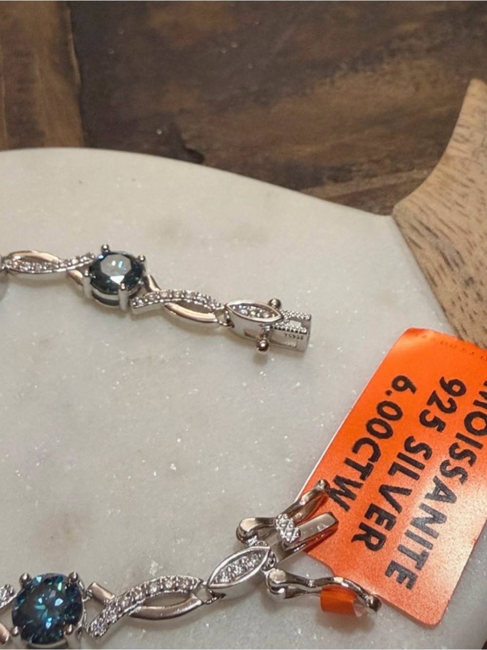 925 Sterling Silver with beautiful blue Moissanite center stones.